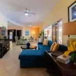 Home for Sale in Casa Linda with Spacious Open-Concept Living Room with 3 sets of Glass Sliders overlooking Tropical Gardens & Pool